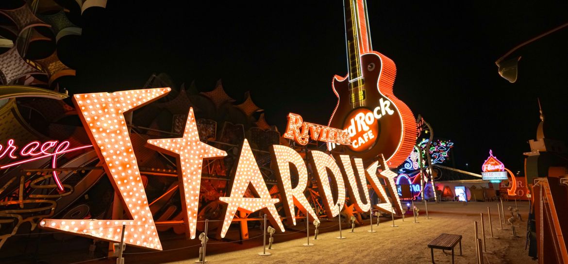 The Stardust sign lit up at the Neon Museum