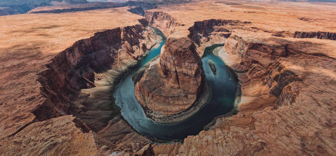 View of Horseshoe Bend in Page, Arizona from inside of a helicopter.