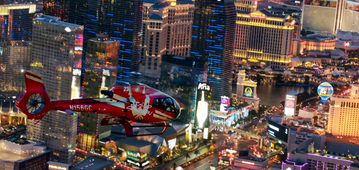 EcoStar Helicopter flying over the Las Vegas at night with views of iconic Las Vegas Strip in the background
