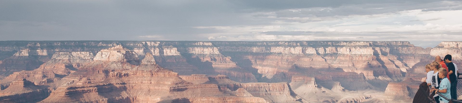A family on the rim of the Grand Canyon National Park