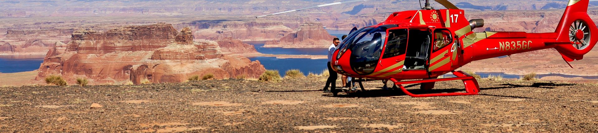 A private helicopter tour landed on the top of Tower Butte with Lake Powell visible in the background