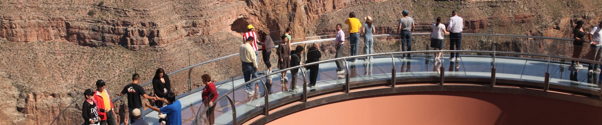 Visitors to the Grand Canyon West Rim stand atop the Skywalk Bridge