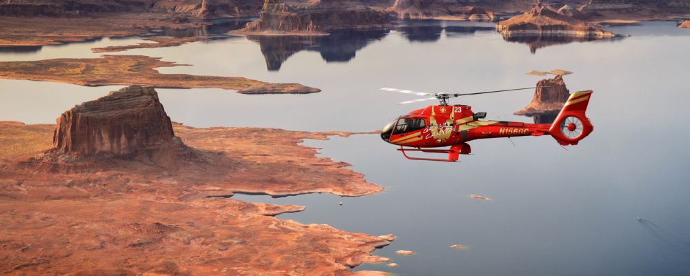 a horseshoe bend helicopter tour flies over lake powell in page arizona