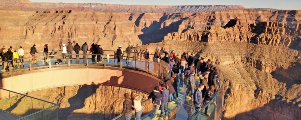 The Grand Canyon West Skywalk with people looking out at the Canyon.
