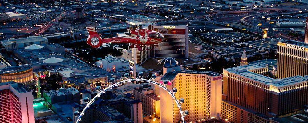 A Las Vegas helicopter tour flies over the Strip at night