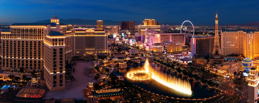 The Las Vegas Strip illuminated at night with the Bellagio Fountains as the focal point