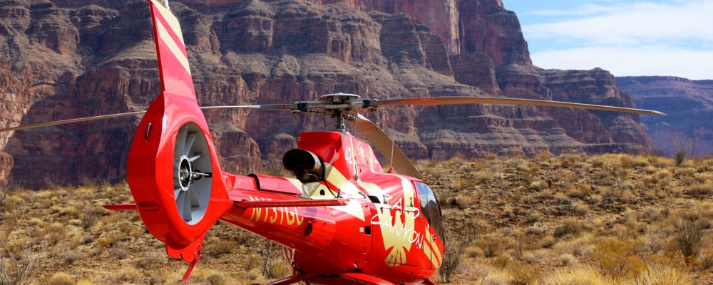 A helicopter on the floor of the Grand Canyon overlooking the scenic beauty.