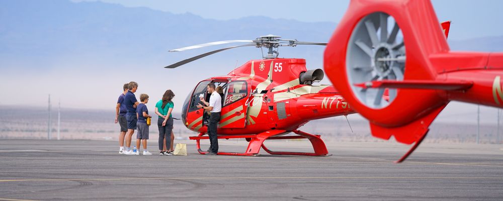A group of passengers prepare to board a Grand Canyon helicopter tour