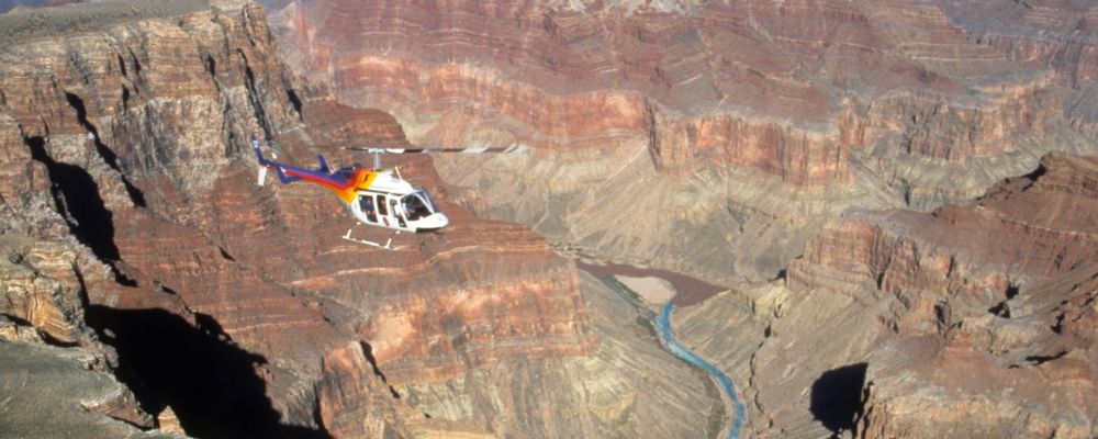 a sightseeing helicopter tour flies over the grand canyon