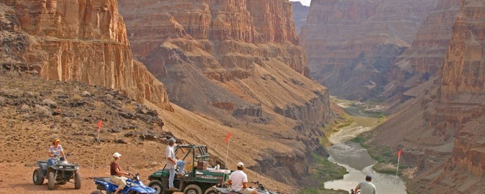 People on ATV looking out over the North Rim of Grand Canyon.