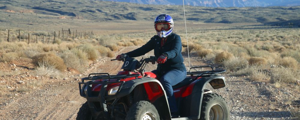 A Bar 10 Ranch guest rides an ATV toward the Grand Canyon North
