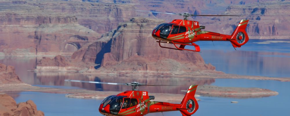 a horseshoe bend helicopter tour flies over lake powell in page arizona