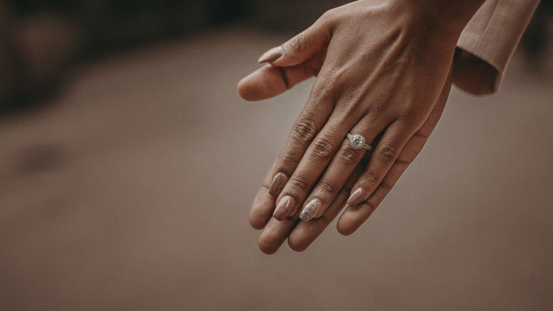 Photo holding hands showing engagement ring after Las Vegas proposal.