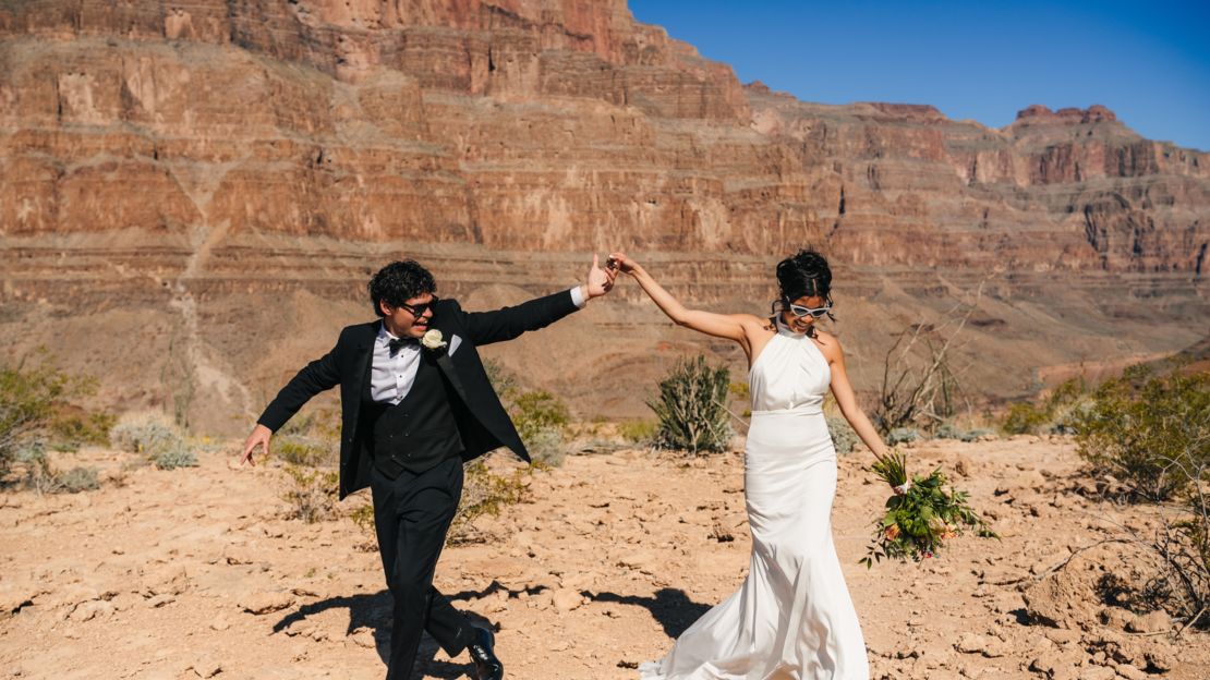 a couple says wedding vows at the bottom of the Grand Canyon after a helicopter flight from Las Vegas