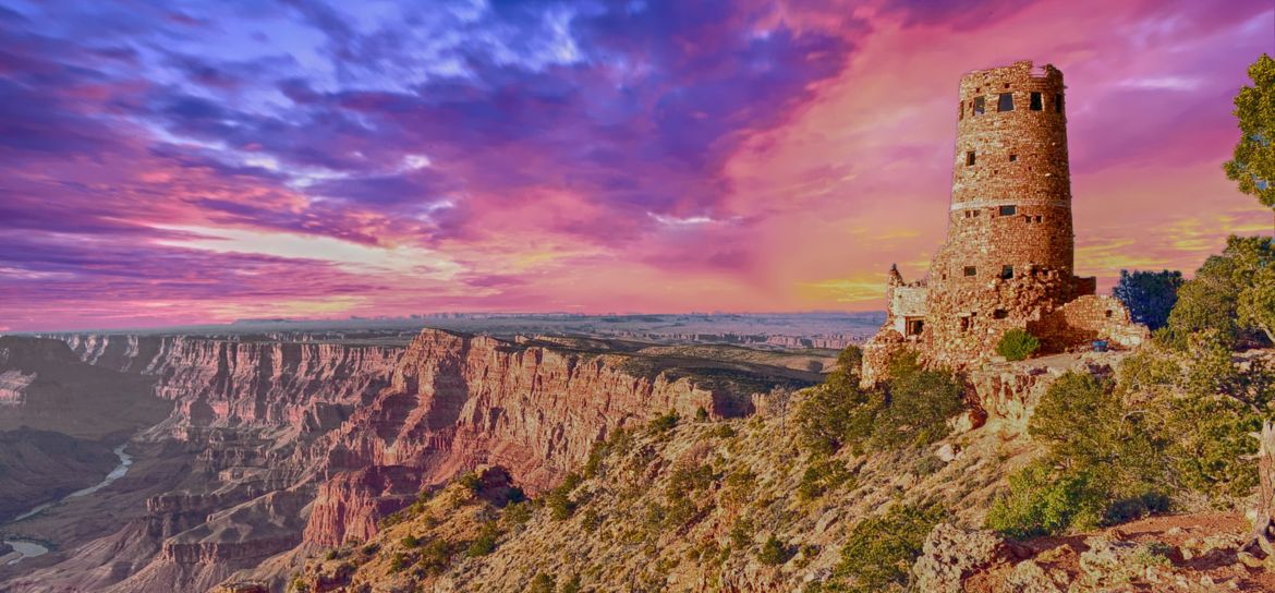 a sunset view of the Grand Canyon National Park with the Desert View Watch Tower in the foreground