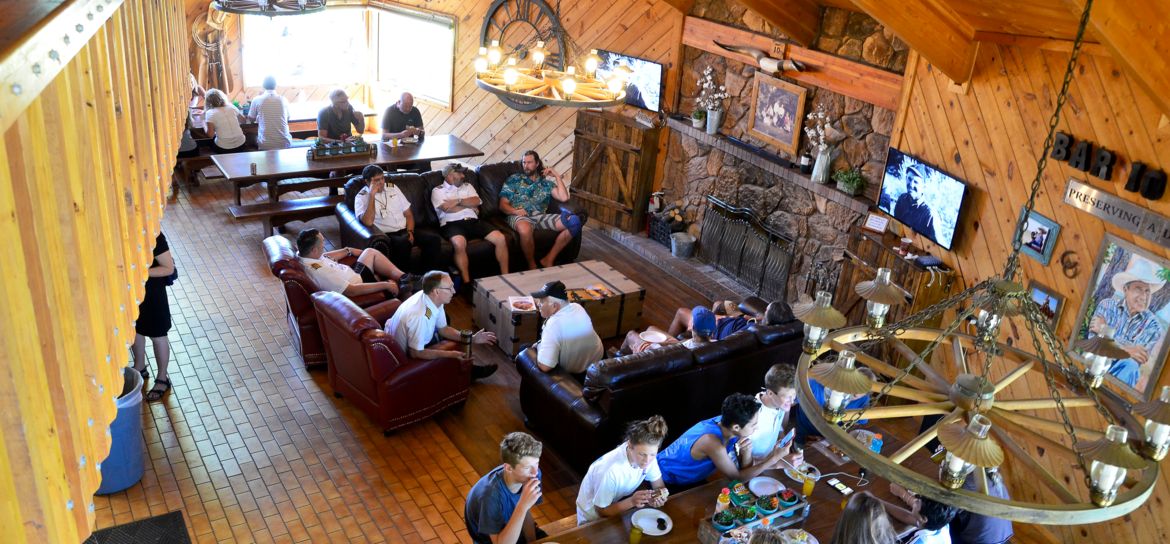 interior of the Bar 10 Ranch dining room where guests are seated eating food