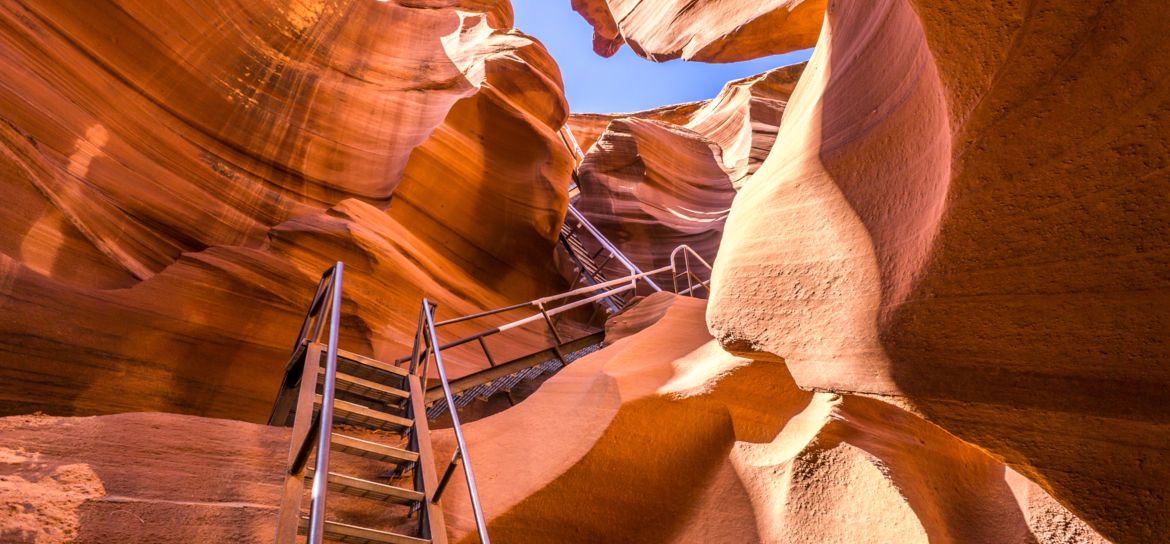 Metal steps leading into Lower Antelope Canyon, seen from the canyon floor