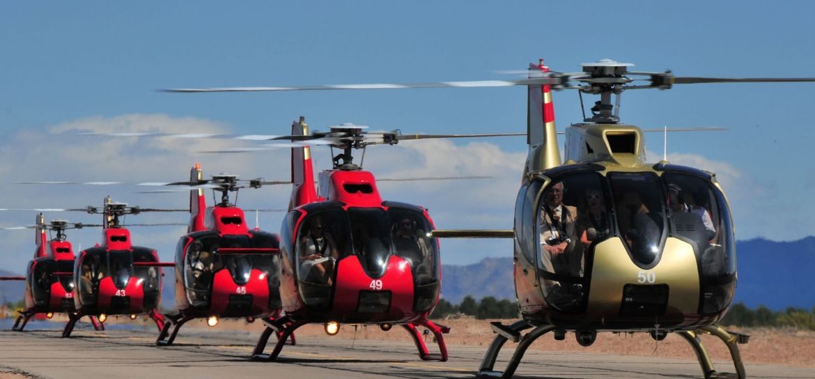 Helicopters on tarmac some of Papillon's fleet of sightseeing helicopters parked on the air terminal tarmac