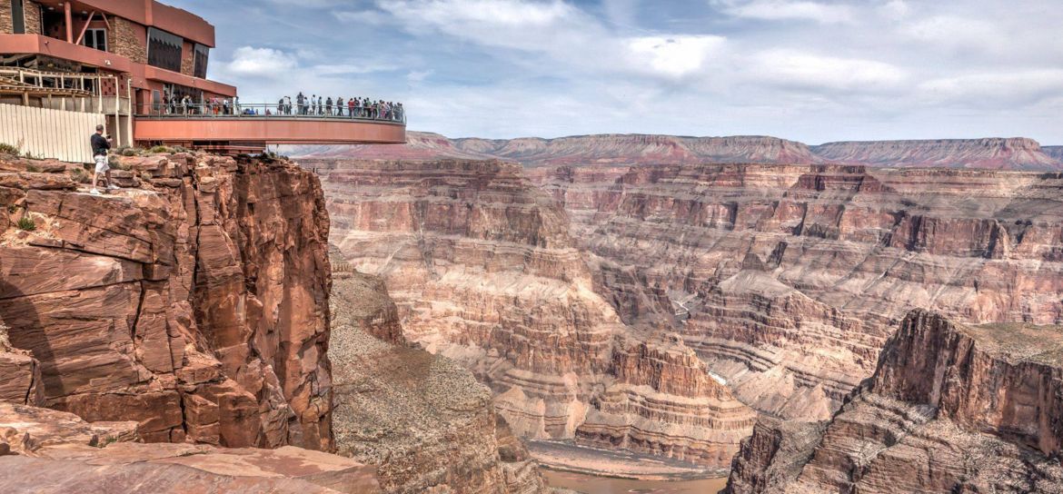 Visitors stand on the Skywalk Bridge at the Grand Canyon West