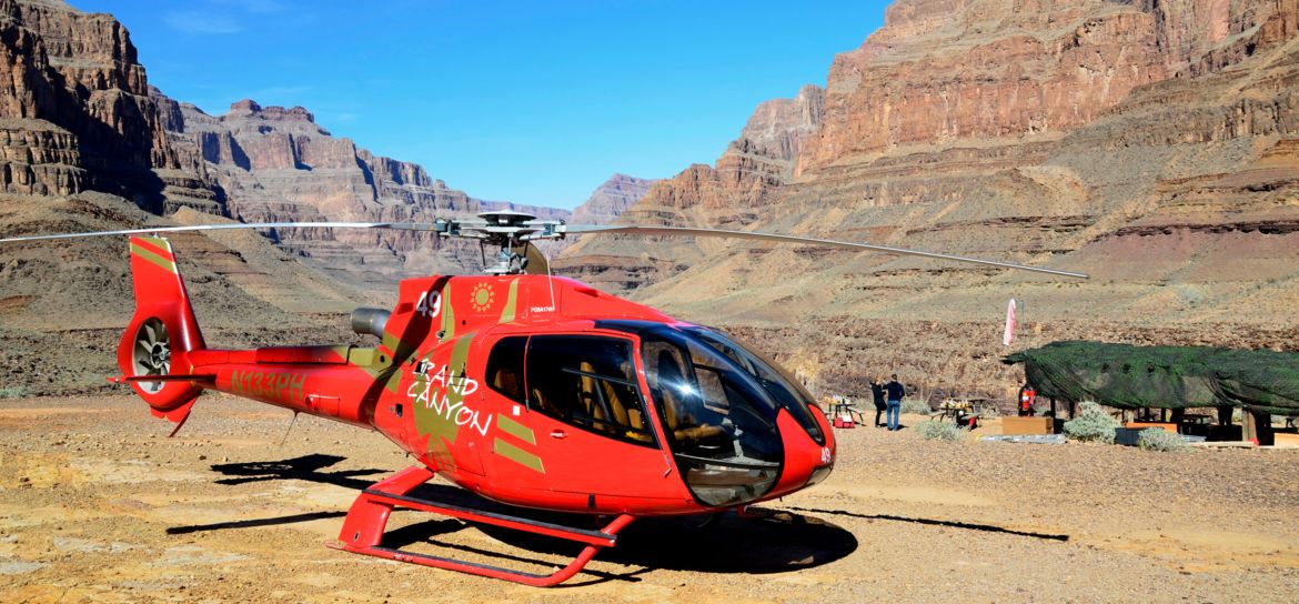 A helicopter landing at the bottom of the Grand Canyon West