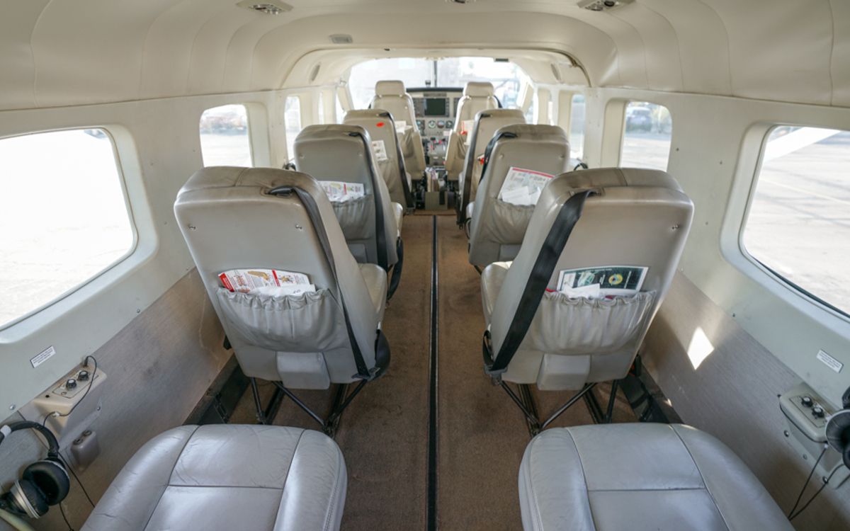 Cabin interior of a Cessna Caravan, showing the 1–1 seating arrangement with a window at every seat
