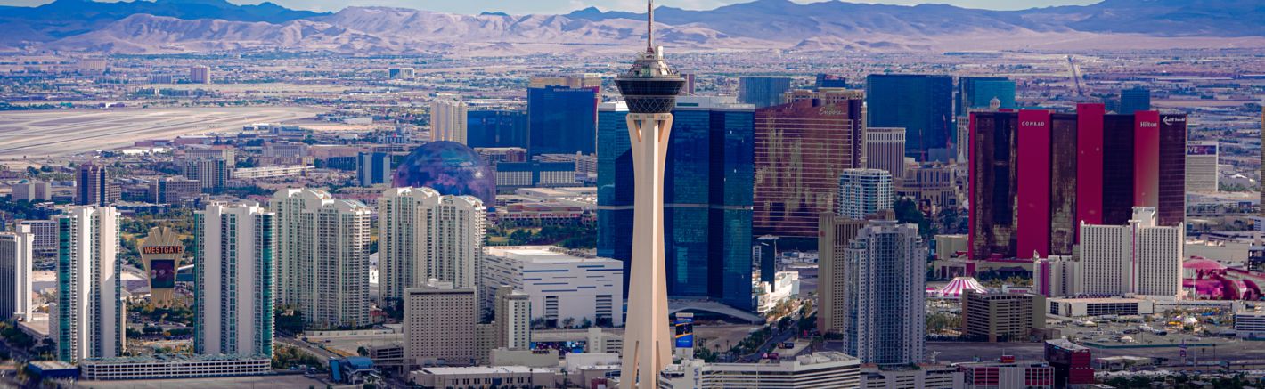 a view of the Las Vegas Strip with the STRAT Tower seen in the foreground