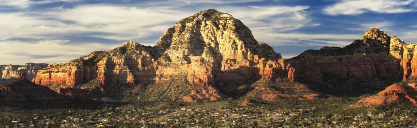 sedona to grand canyon sedona mountains with clouds in the sky