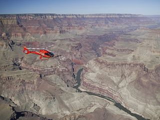 Red Papillon helicopter over the South Rim