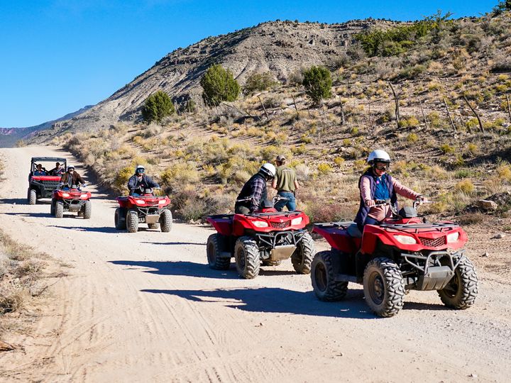 RS12376_DSC4664EDIT-atv-and-utv-parked-on-edge-of-grand-canyon-north-rim-blue-skys