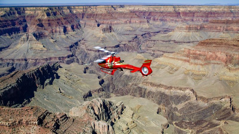 RS19184_RS4672_EDIT-Red-EC130-over-grand-canyon-south-high-contrast