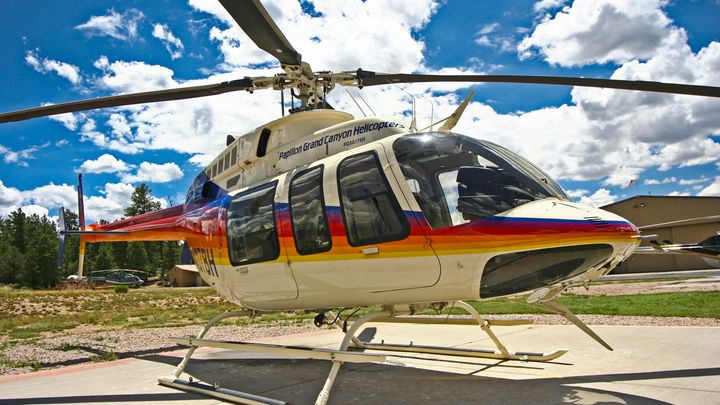 An EcoStar Helicopter flies over the Grand Canyon South Rim
