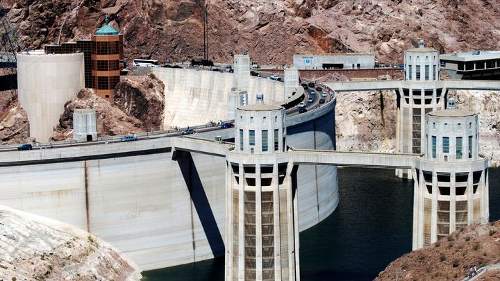 Hoover Dam with cars driving through it