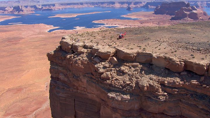 RS8137_11B-red-ec130-helicopter-parked-on-top-of-tower-butte-in-page-arizona