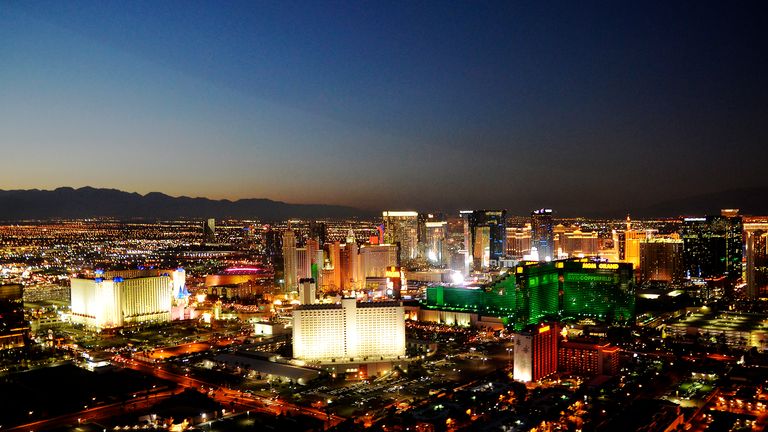 Downtown Las Vegas Skyline at Night with city lights and mountains