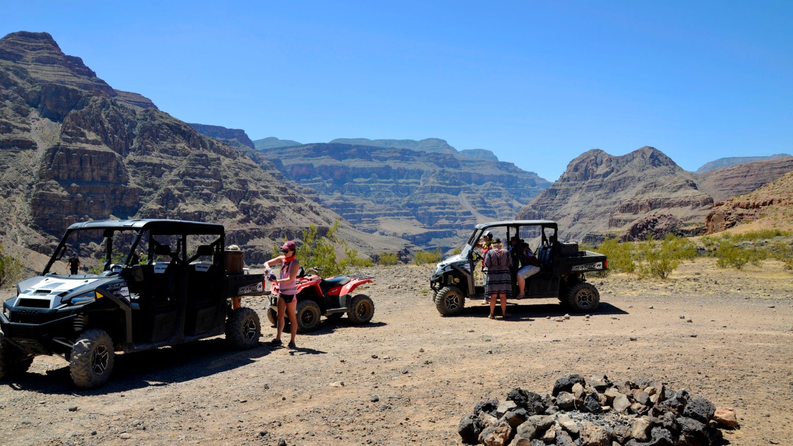 an ATV and two Polaris Ranger off-roading vehicles parked in the North Canyon