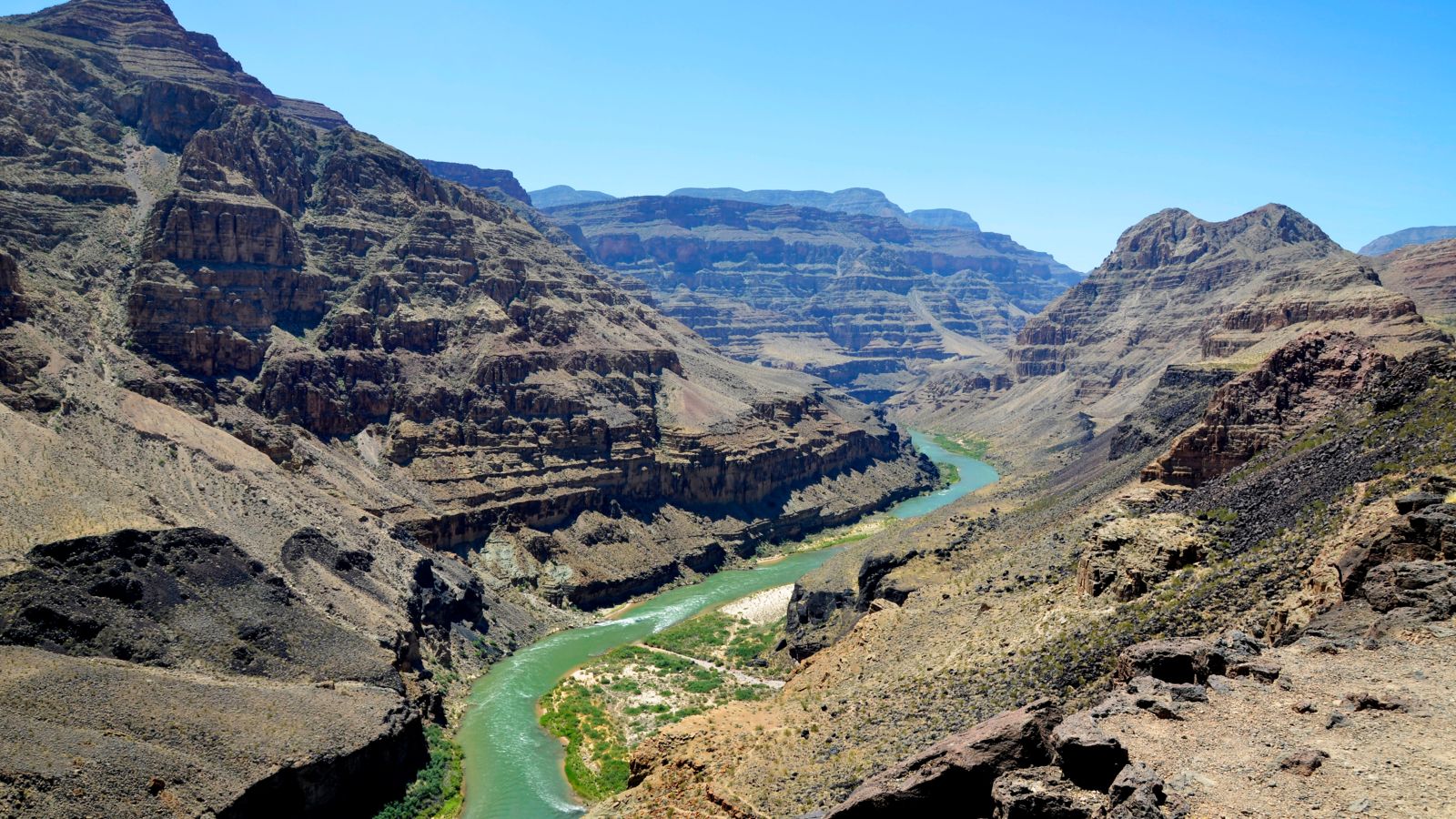 The crystal blue waters of the Colorado River seen within the Grand Canyon North