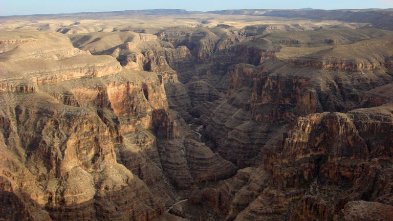 a brightly sunlit aerial view of the Grand Canyon West