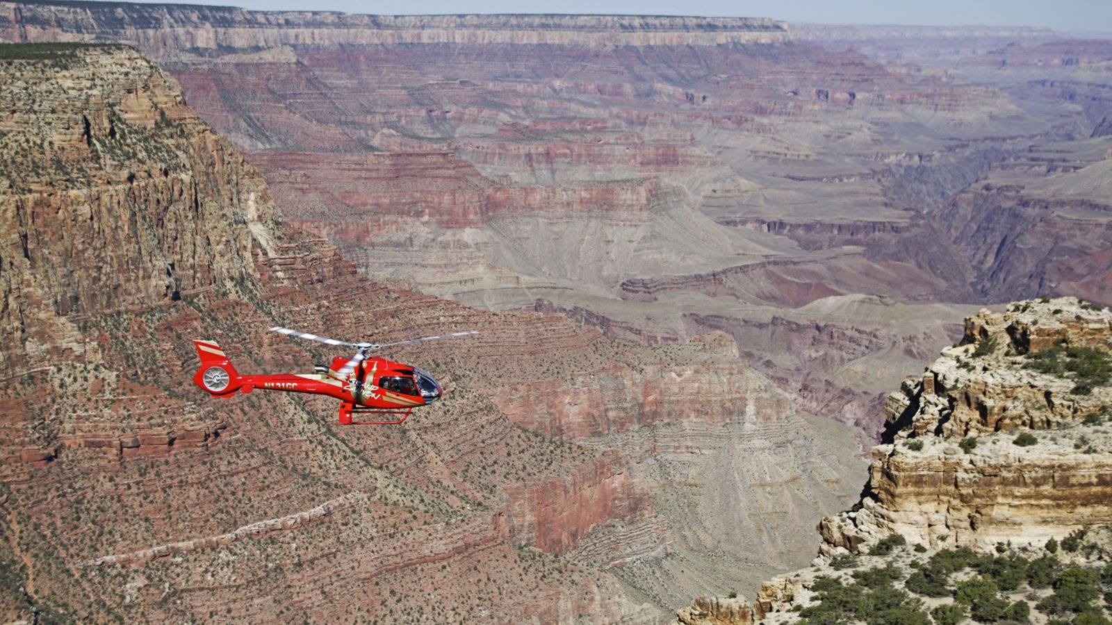 An EC-130 helicopter flies over the Grand Canyon National Park
