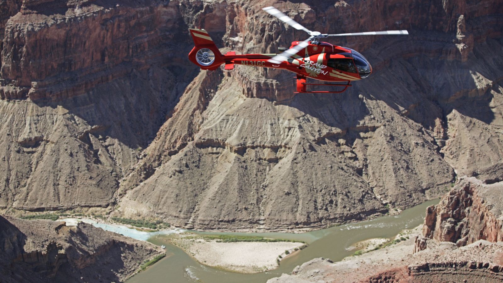 a helicopter flies over the union of the Colorado river and Little Colorado River