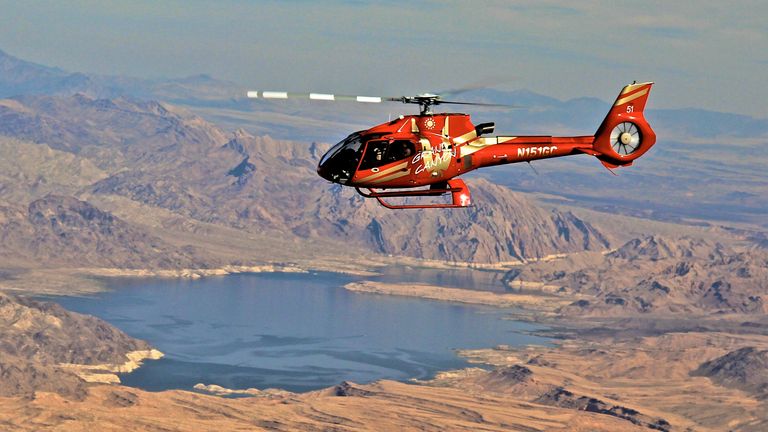 a helicopter tour from Las Vegas flies over nearby Lake Mead