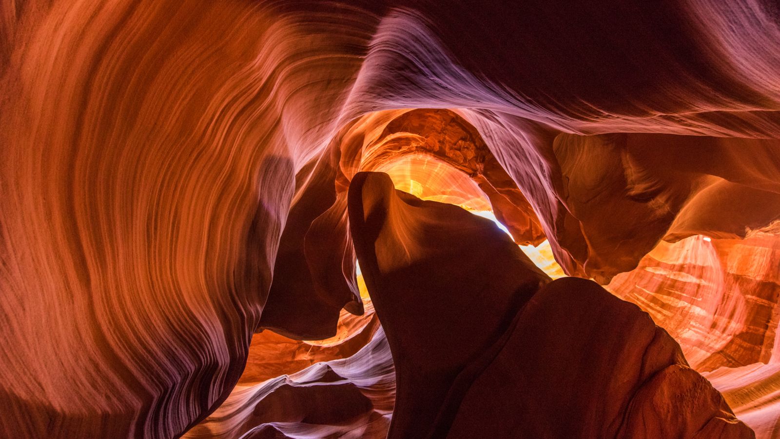 a stunning view taken from the floor of Antelope Canyon featuring rippling sandstone walls