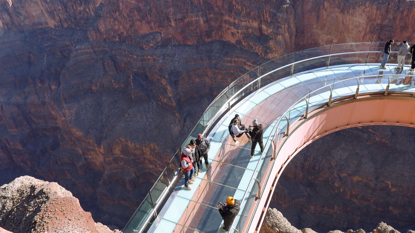 guests to the Grand Canyon West stand atop the Skywalk glass bridge