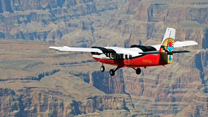 RS14989_MVI_0601-Still-EDIT-red-ec-130-helicopter-landed-next-to-pontoon-boat-ramps-in-grand-canyon-west