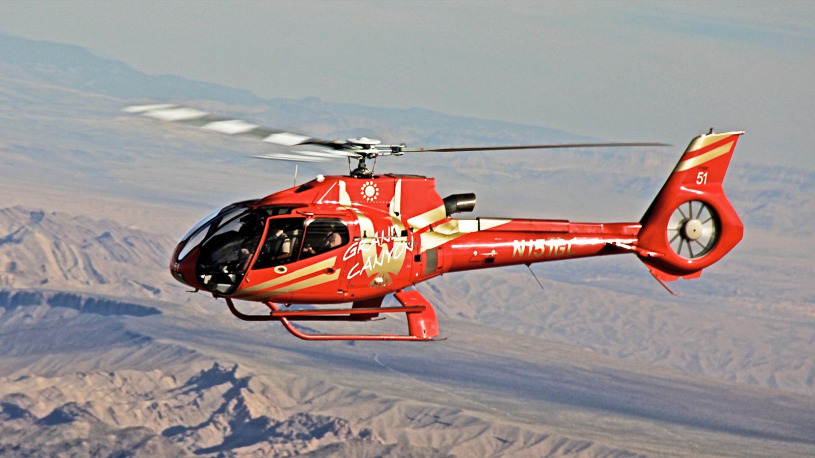 Grand Canyon helicopter tour flying over the stunning rock formations below