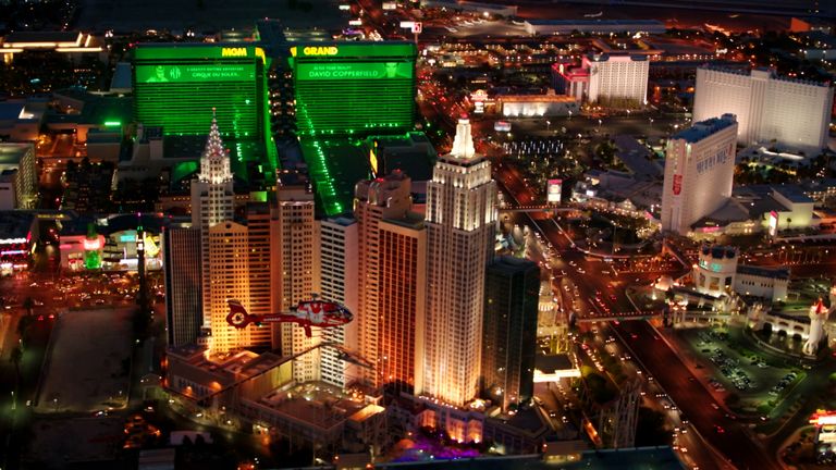 a Las Vegas helicopter tour flies past the new york new york hotel on the Strip