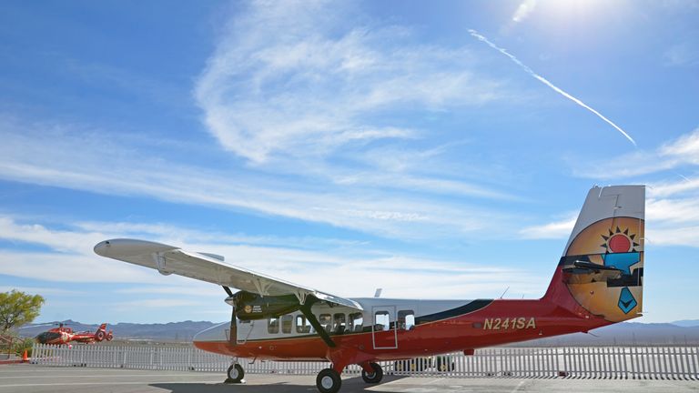 a Las Vegas touring airplane parked on the tarmac at the air terminal