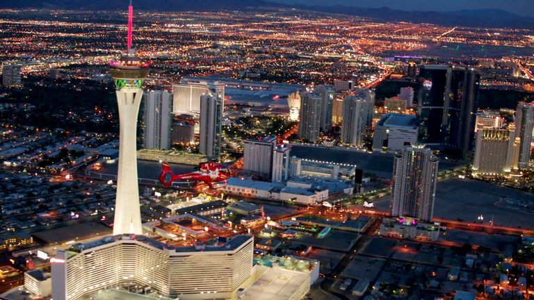 a Las Vegas helicopter makes a turn past the Stratosphere tower