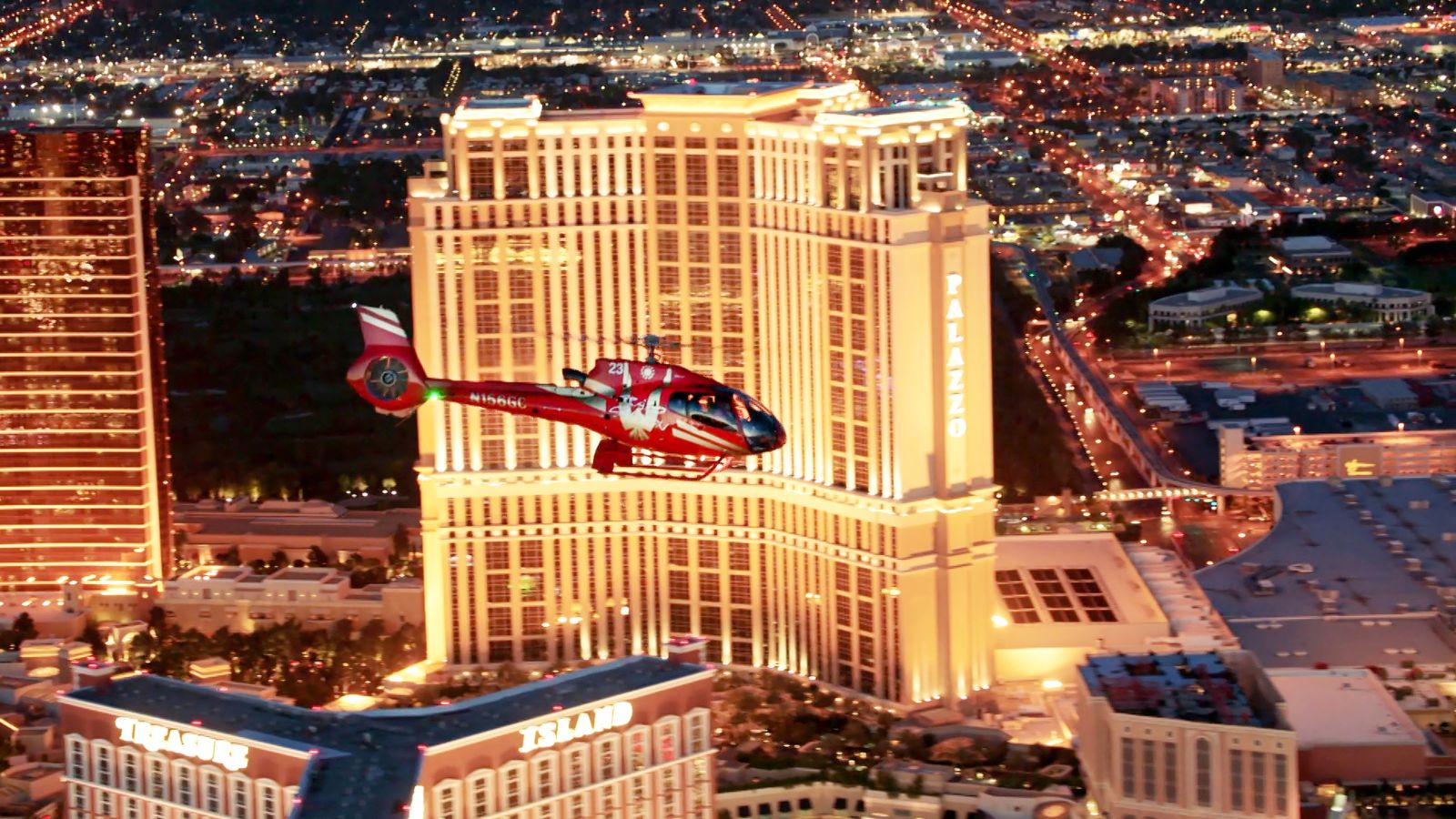 a nighttime Las Vegas helicopter tour flies past the Palazzo hotel