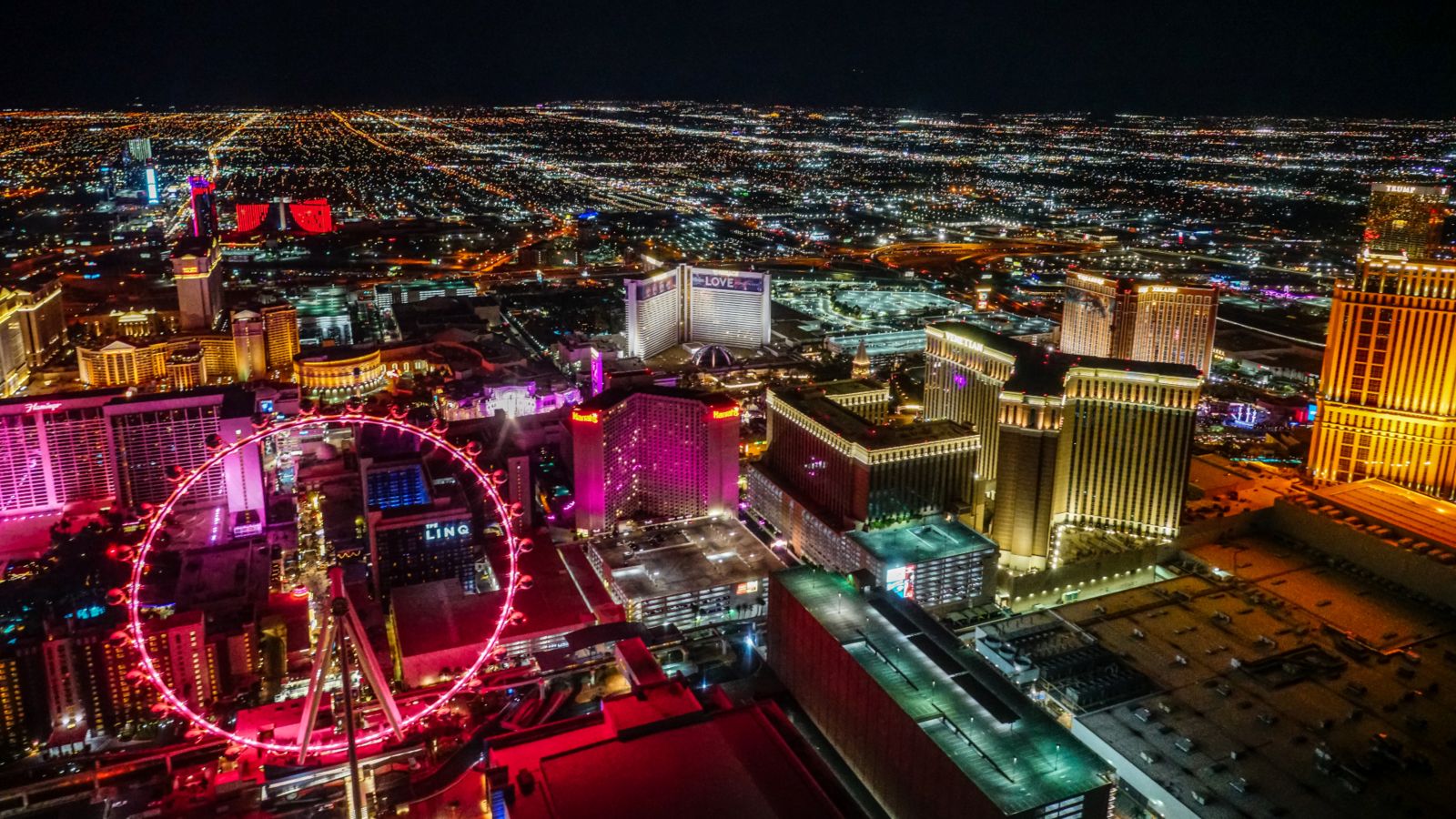 a Las Vegas Strip helicopter tour flies toward the High Roller Observation Wheel