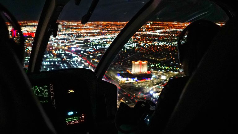 The beautiful Las Vegas Strip seen from inside a helicopter lit up with lights during a nighttime flight on New Year's Eve.